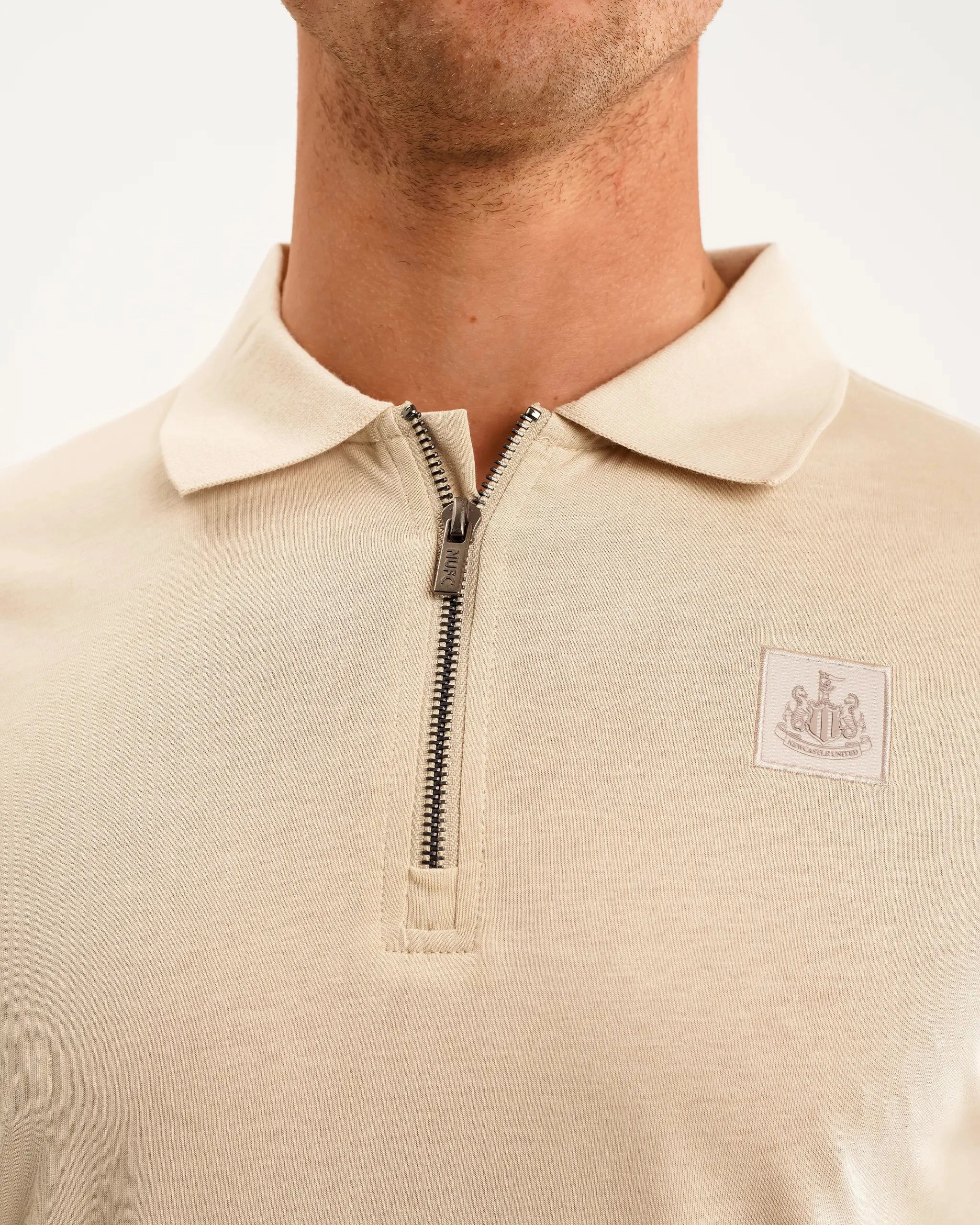 Cozy Top Easy Fit Newcastle United Men's Oat Zipped Polo Shirt