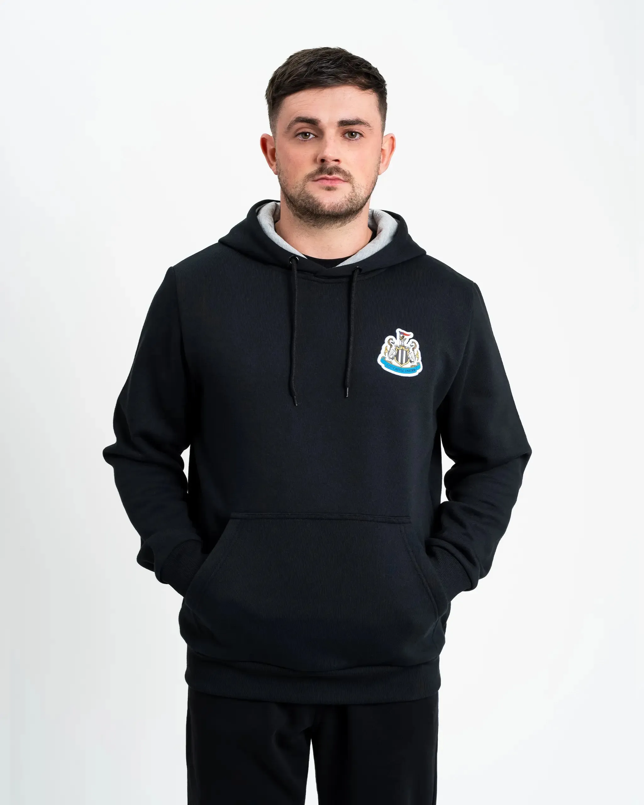 Newcastle United Men's Black Terrace Crest Hoodie Sleek Movement Loose Weave